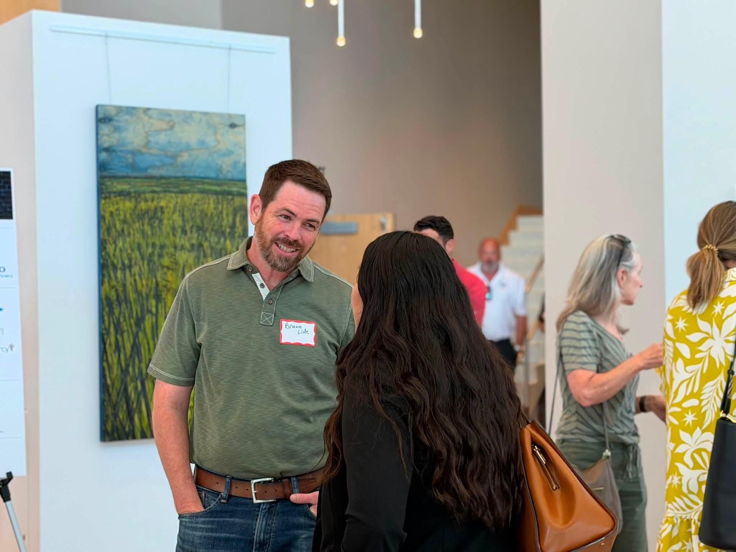 Two members making a connection at a Chamber event